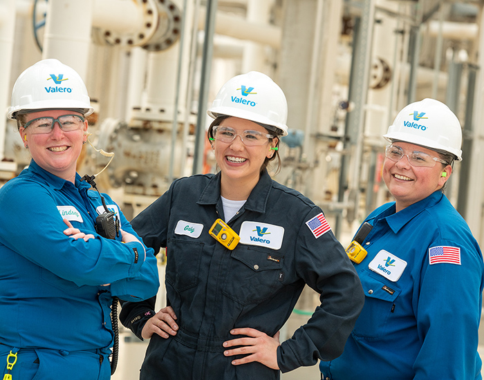 Three female refinery employees